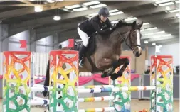  ??  ?? Nina Emery steers 15-year-old Piana to top spot in the 1.20m