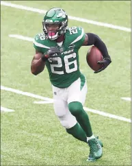  ?? Mike Stobe / Getty Images ?? The Jets’ Le’Veon Bell runs against the Cardinals on Oct. 11 in East Rutherford, N.J.