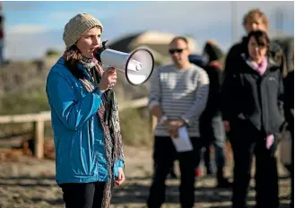  ??  ?? Hands Across the Sand organiser Bridget White speaks at New Brighton Beach in 2016.