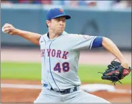  ?? Todd Kirkland / Getty Images ?? The Mets’ Jacob deGrom pitches in the first inning against the Braves at Truist Park on Thursday in Atlanta.