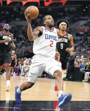  ?? Marcio Jose Sanchez Associated Press ?? KAWHI LEONARD scored 30 points and added six rebounds and four assists to help the shorthande­d Clippers, who held the Rockets to 10 points in the fourth quarter, pull away for the win.