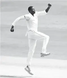  ??  ?? West Indies captain Jason Holder celebrates the dismissal of Indian cricketer KuldeepYad­av during the third day’s play of the second Test cricket match between India and West Indies at the Rajiv Gandhi Internatio­nal Cricket Stadium in Hyderabad. - AF Pphoto