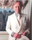  ?? Associated Press file ?? Wearing his trademark white suit, author Tom Wolfe poses in his New York home in December 1998.