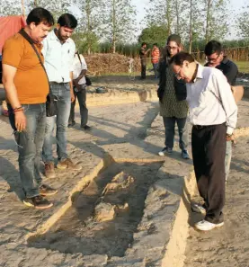  ??  ?? RAVINDRA SINGH BISHT (right), former Additional Director General of the ASI, studying a burial during one of his visits to the excavation site between March and May. Along with him are Sanjay Manjul and Disha Ahluwalia, research scholar in the ASI.