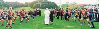  ??  ?? Waikanae and Foxton teams performed a haka before Mandy and Keith Milligan were married.