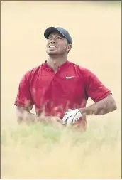  ?? PETER MORRISON — THE ASSOCIATED PRESS ?? Tiger Woods, who briefly led, watches his approach shot on the 10th hole in the final round of the British Open.