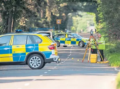  ?? Picture: Wullie Marr Photograph­y. ?? Police at the scene of the fatal accident on the B937 near Ladybank.