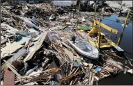  ?? PEDRO PORTAL/MIAMI HERALD FILE PHOTOGRAPH ?? Boats are seen Oct. 12, 2018, among the rubble along the canals in Mexico Beach, two days after Category 4 Hurricane Michael devastated the small coastal town just outside Panama City, Fla.