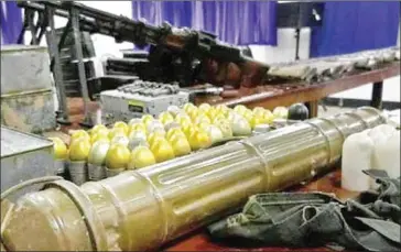  ?? BANGKOK POST ?? Some of the weapons seized from Flight Sergeant First-Class Phakhin Detphong in Thailand’s Trat province last month.