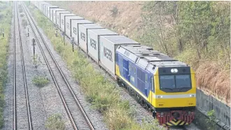  ??  ?? A locomotive runs from the Inland Container Depot in Bangkok’s Lat Krabang district to Laem Chabang port in Chon Buri. The government says it’s on course to speed up delayed double-track railway projects.