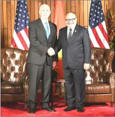  ??  ?? Papua New Guinea’s Prime Minister Peter O’Neill (right) shakes hands with Pence during their bilateral meeting in Port Moresby on the sidelines of the Asia-Pacific Economic Cooperatio­n (APEC) Summit. — AFP photo