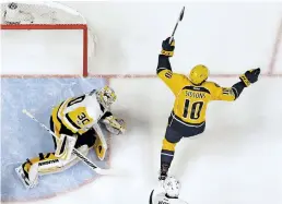  ?? MARK HUMPHREY/THE ASSOCIATED PRESS ?? Predators center Colton Sissons celebrates a goal Saturday as Penguins goalie Matt Murray looks on during the second period of Game 3 of the Stanley Cup Final in Nashville, Tenn. The Predators won, 5-1, and trail the series, 2-1.