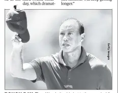  ?? ?? ROUGH DAY: Tiger Woods tips his hat to the crowd while walking to the 18th green during the final round of the Masters.