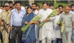  ?? — PTI ?? Union minister Maneka Gandhi with her son and BJP leader Varun Gandhi arrive to pay tribute to Sanjay Gandhi on his 38th death anniversar­y at his memorial in New Delhi on Saturday.