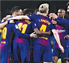  ??  ?? Barcelona players celebrate