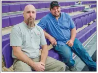  ??  ?? Scott Noble, left, and David Qualls with C.R. Crawford Constructi­on, sit in the stands during the open house. The two worked as the general contractor­s for the new Poyen Sports Complex.
