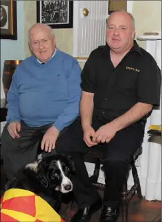  ??  ?? Proprietor John Doyle with his son Joe and his faithful companion ‘Lady’