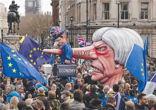  ?? Picture: AP ?? DOOMED: An effigy of British Prime Minister Theresa May is wheeled through Trafalgar Square during a People’s Vote anti-Brexit march in London.