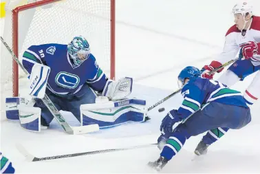  ??  ?? Canadiens forward Alexander Semin can’t get his stick on a rebound in front of Canucks goalie Ryan Miller during the second period in Vancouver on Tuesday.