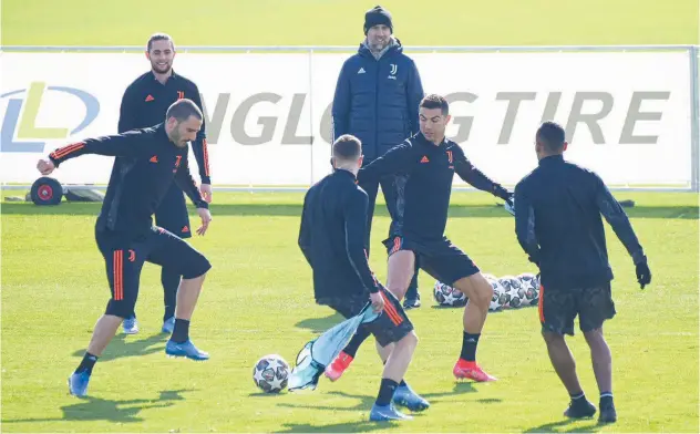  ?? Agence France-presse ?? Juventus players take part in a training session in Turin on Tuesday, ahead of their UEFA Champions League round of 16 first leg football match against Porto.