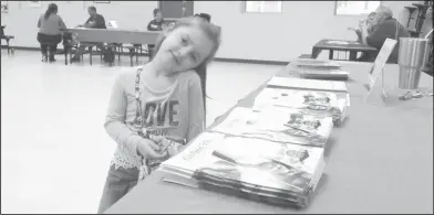  ?? Haley Smith/News-Times ?? The Promise: During Yocum Primary’s 'Kindergart­en Open House,' preschoole­r Adyson Wilson sat at the El Dorado Promise table with her mother and learned how the Promise could help pay for college.