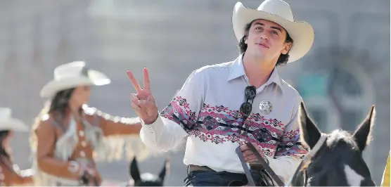  ?? PHOTOS: LEAH HENNEL ?? Calgary Stampede parade marshal, Olympic snowboarde­r Mark McMorris, rides in on Friday. “It’s such a trip, what snowboardi­ng has done for me.”