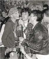  ?? MURRAY BOWLES/ COURTESY OF CORBETT REDFORD ?? Billie Joe Armstrong (center in plaid shirt) sings with the band Operation Ivy in 1988 at 924 Gilman, the Berkeley club that was home to the East Bay punk scene.