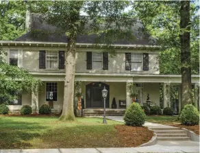  ??  ?? LEFT The Pearce House, built ca. 1911, is a gracious Colonial Revival dwelling. BELOW This style of this stunner might be described as Storybook English-Tudor Arts &amp; Crafts.