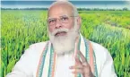  ??  ?? Prime Minister Modi addressing a video conference after releasing the Rs 75 coin to mark the 75th anniversar­y of FAO