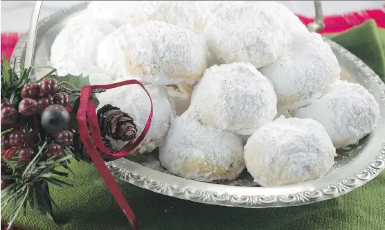  ?? PHOTOS: KAREN BARNABY ?? Kourabiede­s, traditiona­l Greek Christmas cookies, sometimes have a whole clove stuck into the top of each cookie.