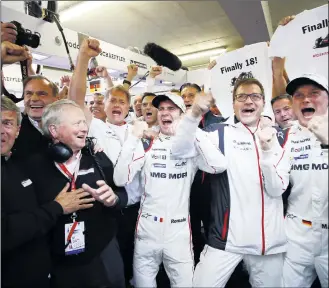  ??  ?? In contrast to Toyota, Porsche celebrated a shock victory with just three minutes left