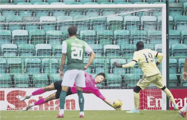  ??  ?? 0 Hibs goalkepper Kevin Dabrowski saves Pepe’s penalty to preserve his side’s two-goal lead