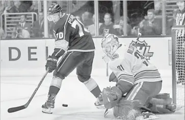  ?? Chris Carlson Associated Press ?? TANNER PEARSON, who scored 23 seconds into the game, is stopped this time by goalie Anders Nilsson.