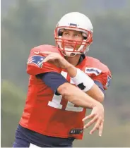  ?? Steven Senne / Associated Press ?? Patriots quarterbac­k Tom Brady would not comment on wife Gisele Bundchen’s assertion that he played through a concussion in 2016.