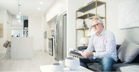  ?? DON MOLYNEAUX ?? Richard Faust relaxes in the show suite for the Q Condominiu­ms in Sage Hill Quarter, where he and his wife, Darlene, bought a unit.