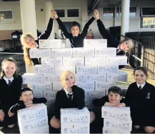  ??  ?? Our Lady of Lourdes School, Birkdale filled 232 shoeboxes with items needed by adults, children and babies in Eastern Europe