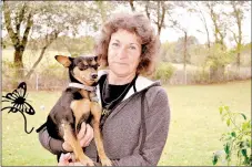  ?? RACHEL DICKERSON/MCDONALD COUNTY PRESS ?? Beverly Bartley of Pineville, president of I’m Your Huckleberr­y Rescue, is pictured with Angie, a rescued dog.