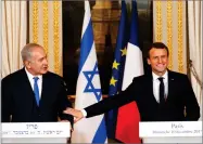  ?? AP PHOTO BY PHILIPPE WOJAZER ?? French President Emmanuel Macron, right, and Israeli Prime Minister Benjamin Netanyahu attend a press conference after a meeting at the Elysee Palace in Paris, Sunday.