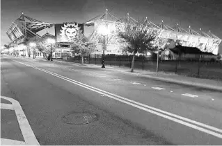  ?? STEPHEN M. DOWELL/ORLANDO SENTINEL ?? An empty Church Street at Exploria Stadium is pictured on April 1, 2020. The Coronaviru­s epidemic caused much of society to shut down due to stay-at-home orders and social distancing measures.