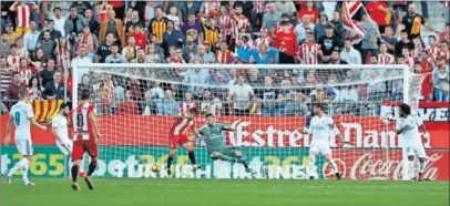 ??  ?? PORTU. Puso la puntilla al Madrid en Girona con este gol que le deja a ocho puntos del Barça.