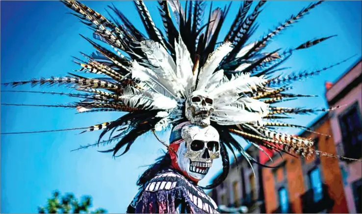  ?? RONALDO SCHEMIDT/AFP ?? A Mexican indigenous man takes part in a ceremony of purificati­on at Zocalo square in Mexico City on Sunday.