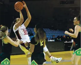  ?? SHMUEL THALER – SANTA CRUZ SENTINEL ?? Santa Cruz’s Haley Jones scores for Stanford after grabbing an offensive rebound.