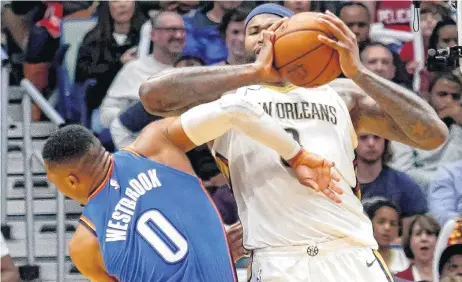  ?? [AP PHOTO] ?? New Orleans Pelicans center DeMarcus Cousins elbows Oklahoma City Thunder guard Russell Westbrook in the head, drawing an ejection from the game, in the second half of Monday’s game in New Orleans. The Pelicans won, 114-107.