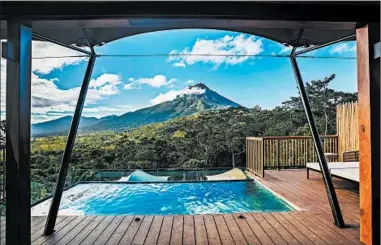  ?? THE NEW YORK TIMES PHOTOS ?? The pool at Nayara Tented Camp, an air-conditione­d tent camp in the Arenal Volcano National Park in Costa Rica.