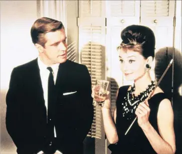  ?? Paramount Pictures ?? GEORGE PEPPARD with Audrey Hepburn in her classic role as Holly Golightly in “Breakfast at Tiffany’s.”