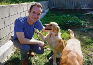  ?? PHOTOS BY GREGORY BULL/ASSOCIATED PRESS ?? Alex Willen was preparing to open a dog boarding business in San Diego before the pandemic hit. That meant dog owners wouldn’t be traveling and many would be working at home, eliminatin­g the need for his services. He restarted a business he had shelved: dog treats.