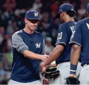  ?? JASON GETZ / USA TODAY SPORTS ?? Brewers manager Craig Counsell removes struggling starter Freddy Peralta in the fourth.