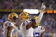  ?? GERALD HERBERT - THE ASSOCIATED PRESS ?? LSU wide receiver Ja’Marr Chase (1) celebrates his touchdown reception in the second half of an NCAA college football game against Florida in Baton Rouge, La., Saturday, Oct. 12, 2019. LSU won 42-28.