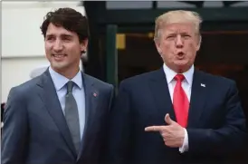  ?? The Canadian Press ?? Prime Minister Justin Trudeau is greeted by U.S. President Donald Trump as he arrives at the White House in Washington, D.C., on Wednesday.