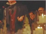  ?? AP PHOTO/TAMMY LECHNER ?? Tonya Brown listens to the opening sermon during a candleligh­t vigil in 1996 at Salt Creek Beach in Dana Point, Calif., to commemorat­e the second anniversar­y of the murder of her sister, Nicole Brown Simpson.